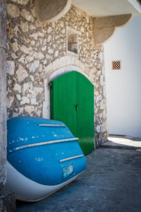 Boat, wall of a house Boat, wall of a house
